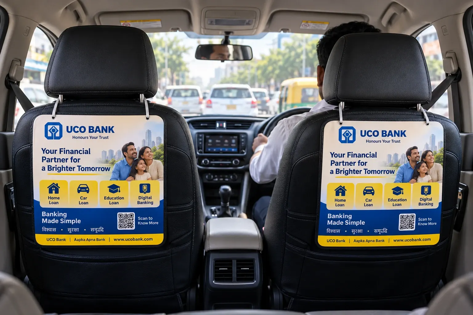 Two advertising panels hanging on the back of the front seats inside a cab